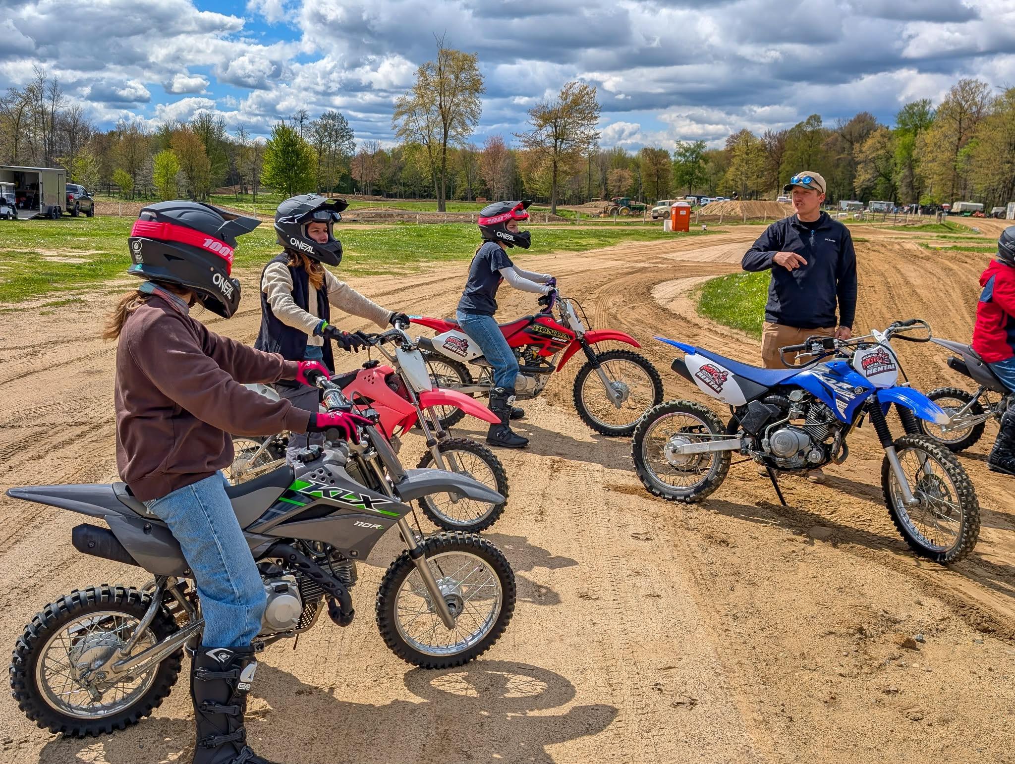 photo of coach working with student rider